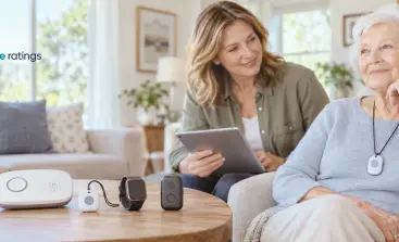 Senior woman wearing a wearable medical alert button pendant around her neck at home.