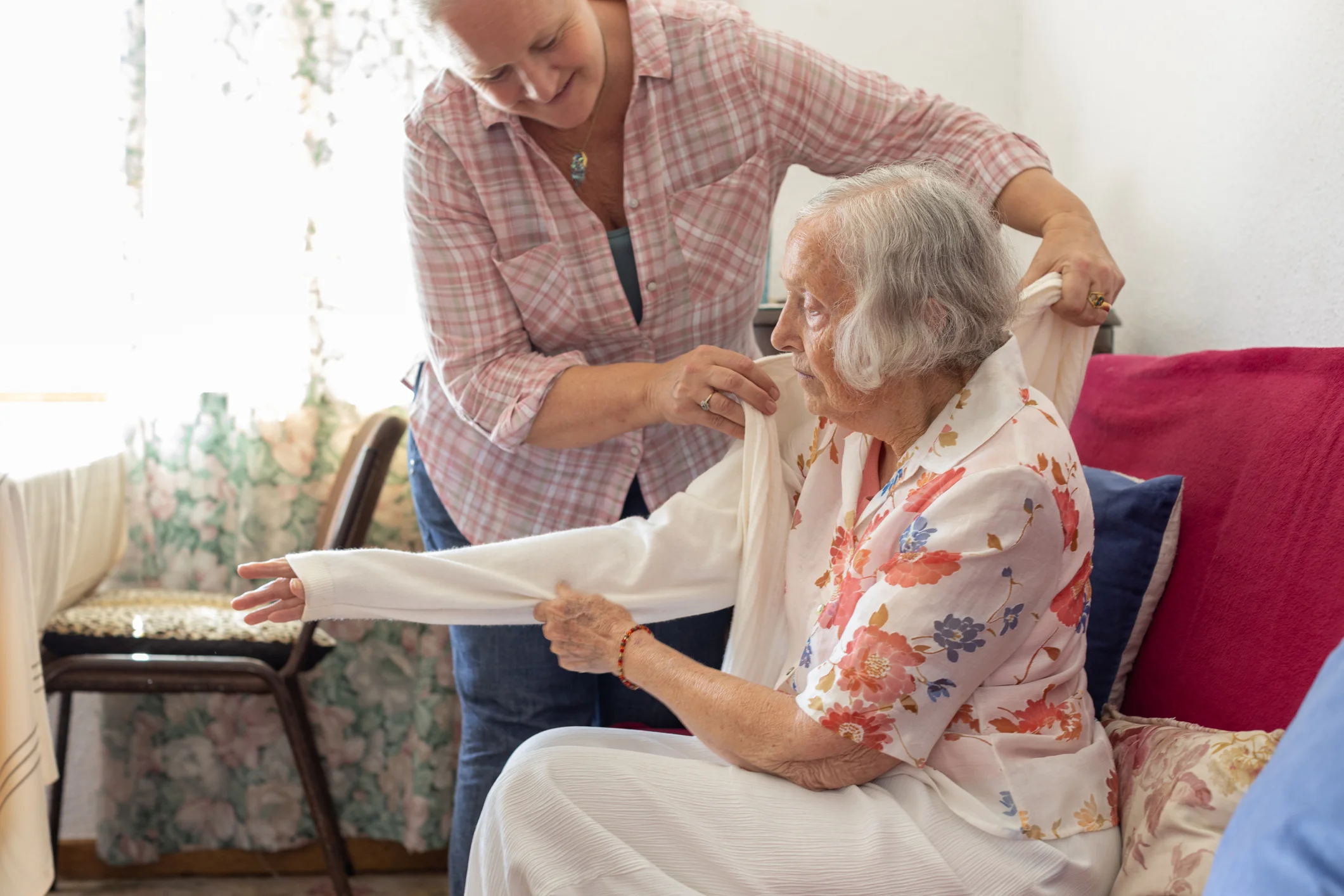Home health nurse providing in-home medical care to a patient